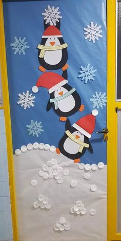 a door decorated with penguins and snowflakes