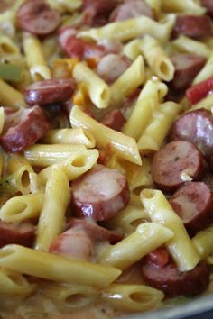 pasta with sausages and noodles in a pan