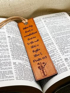 an open bible with a bookmark on it