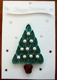 a card with a christmas tree made out of rolled paper