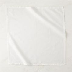 a plain white napkin folded on top of a table