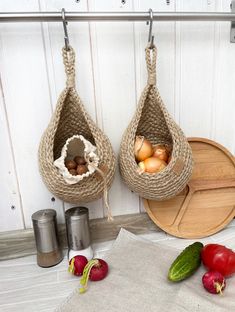 two baskets filled with vegetables sitting on top of a table