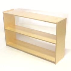 a wooden shelf sitting on top of a white floor