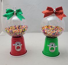 two snow globes decorated with bows and sprinkles