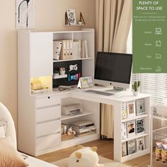 a white desk with a computer on top of it and bookshelves in the background