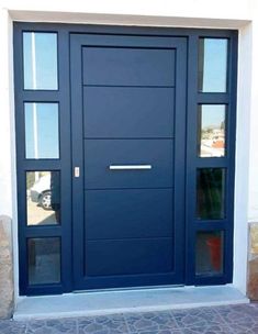 a blue front door with two sidelights