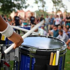 a drum player with bandages on his arm is playing the drums in front of an audience