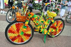 two bicycles decorated with flowers on the street