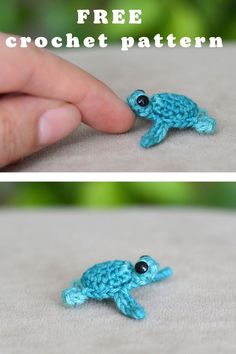 the crocheted fish is being held up by someone's hand and it looks like