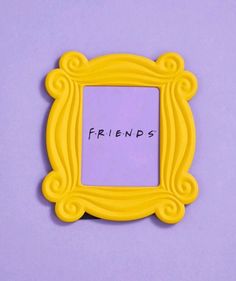 a yellow frame with the word friends written in black ink on it, against a purple background