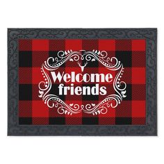 a welcome mat with the words welcome friends in red, black and white on it