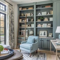 a living room filled with furniture and bookshelves next to a large open window