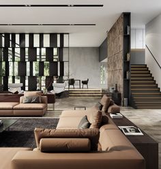 a living room filled with lots of couches and chairs next to a stair case