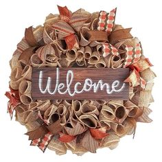 a welcome wreath with burlocks and ribbon around it on a white background that says welcome