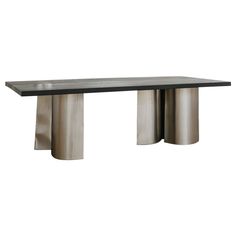 a black and silver table with two metal pillars on it's sides, against a white background