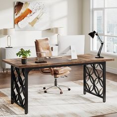 an office with a desk, chair and computer on it in front of a window