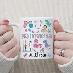 a woman holding a coffee mug with the words pediatrician on it and various medical icons