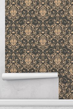 an ornate wallpaper with gold and black designs