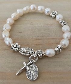 "Item details Handmade Rosary Bracelet for Women Stretch Bracelets, freshwater pearl, Lady of Guadalupe, miraculous medal and small cross  The size of the bracelet is 6'5\" This will be a great gift for confirmation!  A unique and beautiful personalized rosary bracelet!  It will make a perfect religious themed gift or inspiration for yourself. The beads used on every piece are handpicked. We make sure that each bracelet includes a range of the natural colors found in the stone It is not guaranteed to look exactly the same as shown in pictures but we promise it will be just as pretty!" Catholic Rosary Bracelet, Catholic Bracelet, Personalized Rosary, Formal Jewelry, Bracelets Design, Diy Bracelets Easy, Lady Of Guadalupe