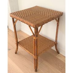 a small table made out of wicker on the floor