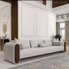 a large white couch sitting in a living room