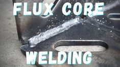 a close up of a metal object with the words flux core welding