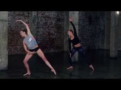 two people are doing yoga in an empty room