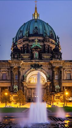 an image of a building with a fountain in front of it