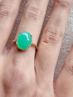 Chrysoprase ring in 10 carat yellow gold, quality green Chrysoprase ring, oval cabochon Chrysoprase ring The Chrysoprase measures 14x10mms and weighs 5.4 carats The ring is in 10 carat yellow gold Ring size is M (Australian size) or 7 1/4 (US size). Ring is ready to ship in 1-2 working days.  We resize free of charge.  Please allow a couple of additional days for resizing. All my rings come in a velvet ring box.  I am highly conscious of environmental damage that extra packaging can create so my Elegant Green Opal Ring Oval Cabochon, Elegant Green Opal Ring With Oval Cabochon, Classic Green Oval Opal Ring, Elegant Green Opal Oval Ring, Green Oval Opal Ring For Formal Occasions, Classic Green Opal Cabochon Ring, Green Oval Opal Ring, Classic Green Cabochon Emerald Ring, Yellow Gold Emerald Chrysoprase Cabochon Ring