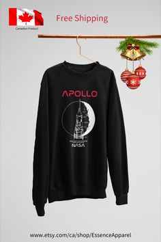 a black sweatshirt hanging on a clothes line with the text, free shipping from canada