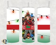 two tall candles with christmas lights and a photo on the front one is red, white and green