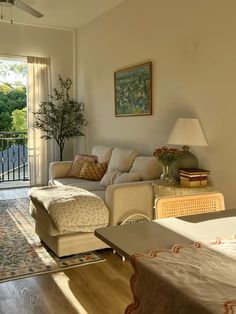 a living room filled with furniture next to a sliding glass door leading to a balcony