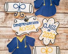 graduation cookies decorated with royal blue and yellow icing on wooden background, congratulations alyssa class of 2020