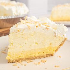 a piece of pie on a plate with the rest of the pie in the background