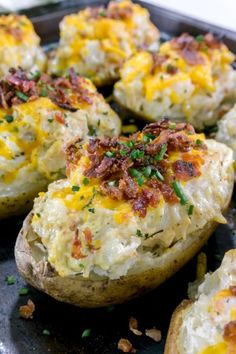 baked potatoes with bacon and cheese on a baking sheet