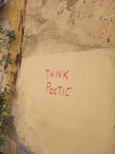 graffiti on the side of a building that says think pogettic written in red