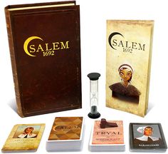 the salem board game is in its original box and includes several cards, including one with a woman's face on it