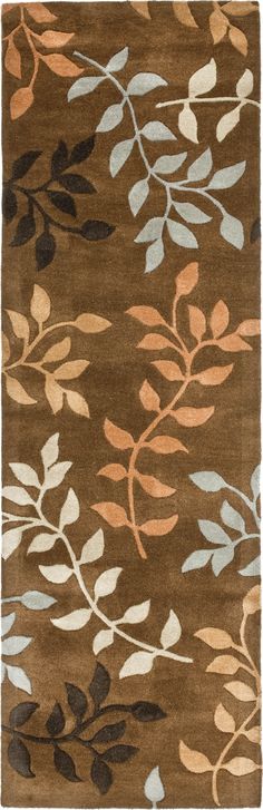 a brown rug with leaves on it