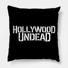 a black pillow with the words hollywood under - ad printed on it in white letters