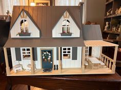 This Magnolia Farmhouse has been built and customized with care. It includes all the furniture and accessories shown. The dimensions are 24" high, 36" wide and 17" deep. This is a 2 story, 6 room dollhouse. Most of the floors are made of real wood with the exception of the bathroom and kitchen floors. There are baseboards and some cornice boards installed. The house itself is made of real wood.  This dollhouse would be perfect to display as a conversation piece/decor in your home. It would make a lovely gift for children over 3 years old. The small pieces should be considered a choking hazard. Hearth And Hand With Magnolia Dollhouse, Hearth And Hand Dollhouse, Dollhouse Farmhouse, Dollhouse Exterior, Magnolia Farmhouse, Farmhouse Dollhouse, Miniature Farmhouse, Mini Farmhouse, Cottage Dollhouse