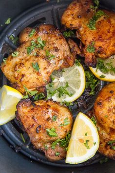 chicken with lemons and parsley in a skillet