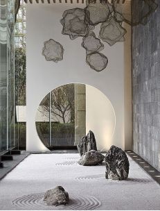 a large room with rocks and mirrors on the wall