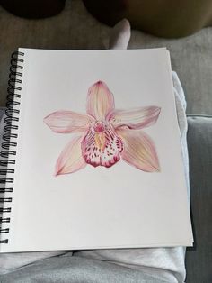 a drawing of a pink flower on a white paper