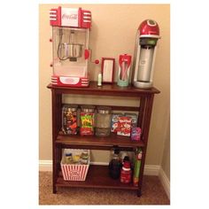 there is a shelf with food and drinks on it next to the coffee maker in the corner