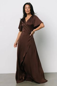 Wrap yourself in sophistication with our Vara Satin Maxi Wrap Dress in Espresso, adorned with flutter sleeves for a feminine touch. This versatile and elegant dress is perfect for any occasion, whether it's a wedding, cocktail party, or night out on the town. Fall Formal Dresses, Brown Wrap Dress, Wedding Guest Dresses Long, Brown Midi Dress, Wedding Cocktail Party, Plum Dress, Satin Wrap Dress, Fall Wedding Guest Dress, Baltic Born