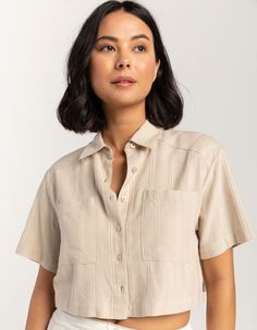 Rsq Crop Shirt. Crafted With Soft And Breathable Fabric, This Shirt Features A Trendy Cropped Silhouette That's Perfect For Pairing With High-Waisted Jeans Or Skirts. With Its Button Front, Chest Pockets, And Collared Neckline, This Shirt Offers A Classic And Timeless Look With A Modern Twist. Short Sleeves. 55% Cotton, 45% Viscose. Machine Wash. Imported. Model Is Wearing A Size Small. Model Measurements:height: 5'8" Bust: 32"waist: 25"hips: 36" Cheap Basic Tops With Embroidered Text, Cropped Short Sleeve Button Up, Crop Button Down Shirt Outfit, Short Sleeve Button Up Shirt Outfit, Cropped Button Up, Crop Button Up Shirt Outfit, Cropped Button Up Shirt Outfit, Casual Shirts Women, Crop Shirts For Women