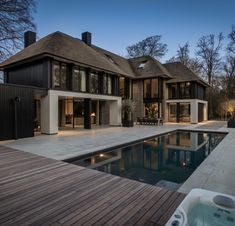 a large house with a pool in front of it