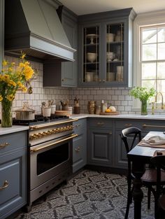 a kitchen with gray cabinets and yellow flowers