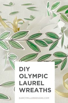 some white paper with green leaves on it and the words diy olympic laurel wreaths