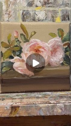 an oil painting of pink roses on a canvas